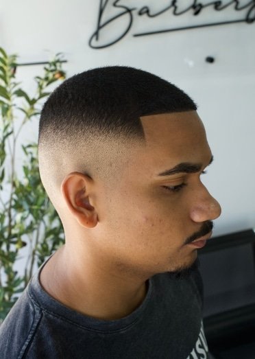 Buzz cut hairstyle with a clean fade in Hialeah