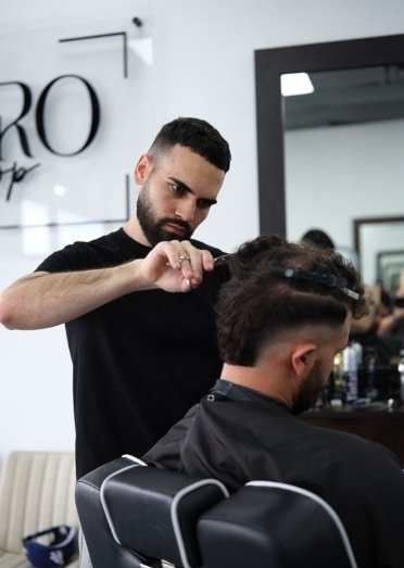 Taper fade haircut style performed by expert barbers